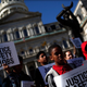 Children from the Pleasant Hope Baptist Church attend a rally and news conference held by the Campaign for Justice, Safety and Jobs in Baltimore. During the rally, the advocacy group called for a “six-point plan for police reform in Baltimore.” (Win McNamee/Getty Images)